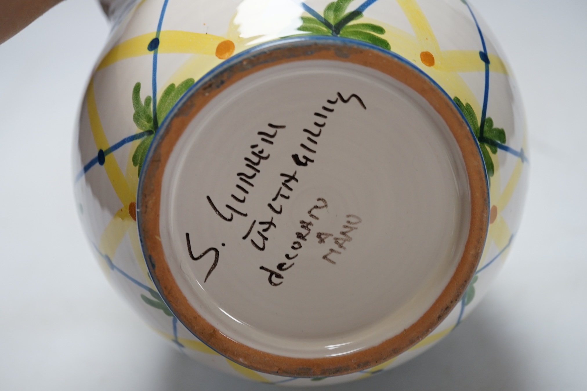 From the Studio of Fred Cuming. An Italian maiolica ‘lemons’ jug, 20cm high. Condition - good